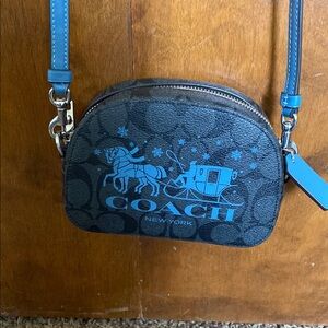 Coach Blue and Black Crossbody Bag with Modern Design.
